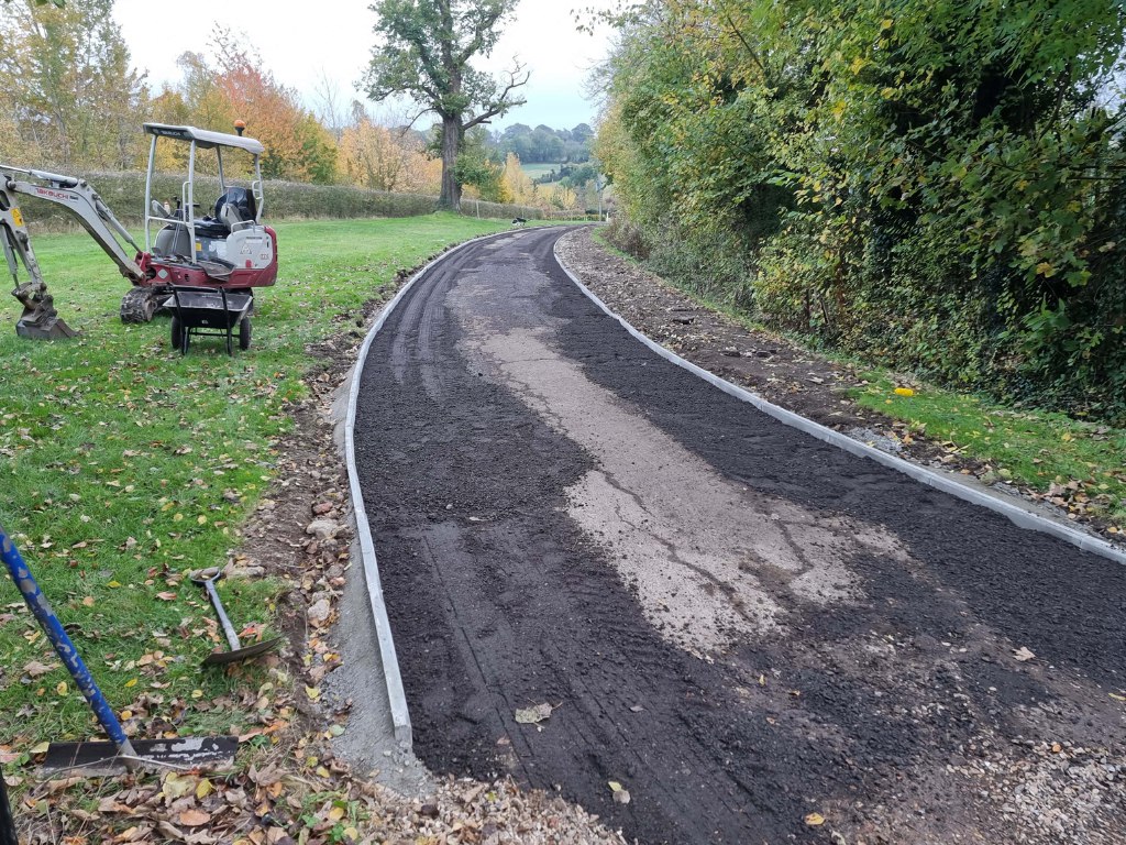 This is a large driveway which is in the process of having a tar and chip driveway installed on by Ashford Driveways