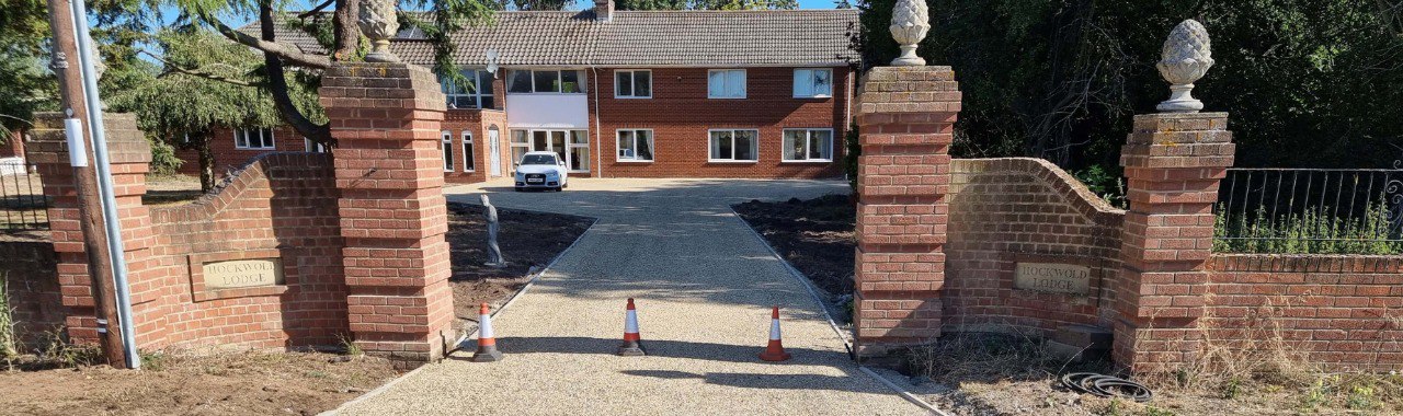 This is a photo of a newly installed chip and tar driveway, installed by Ashford Driveways
